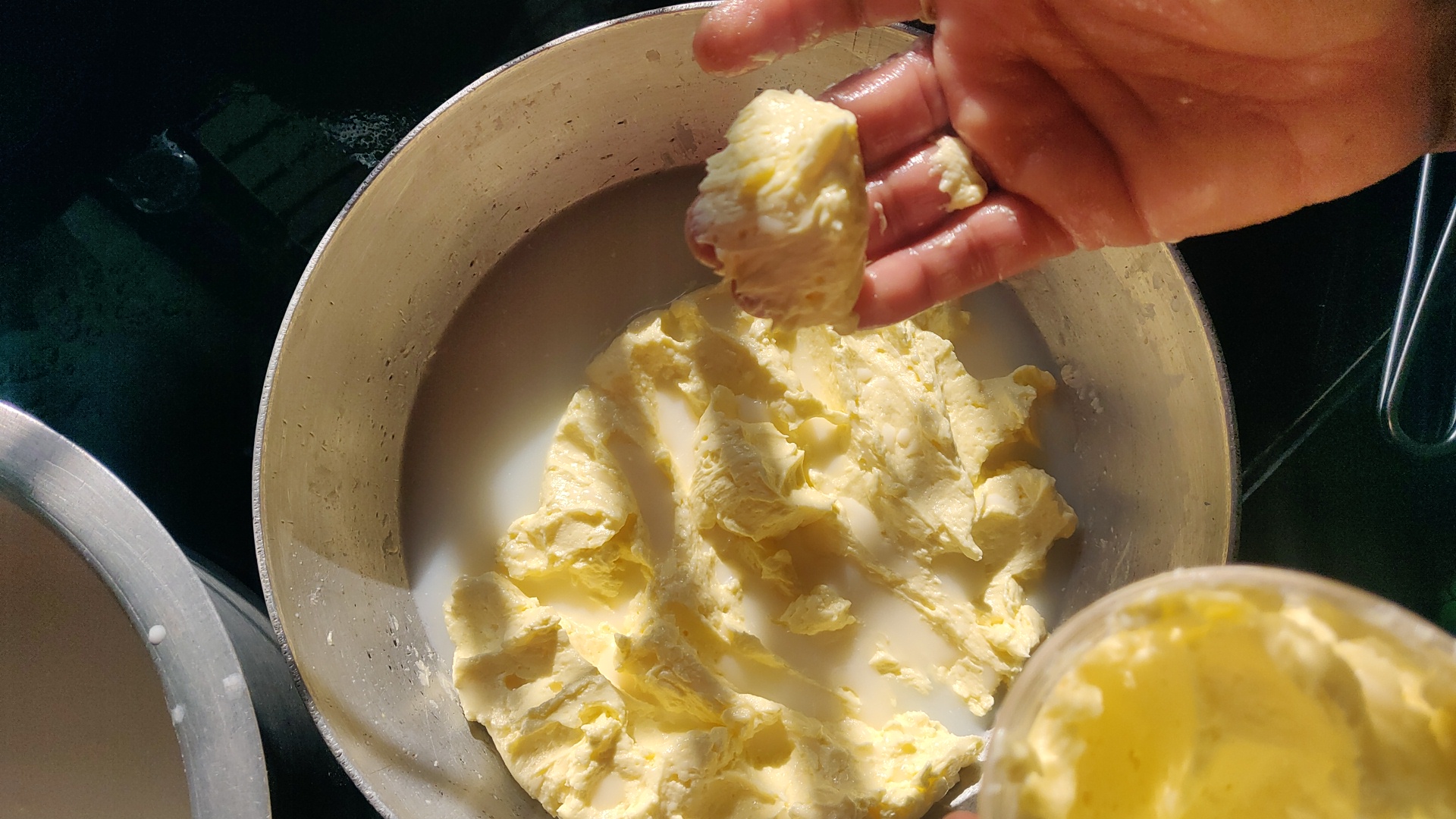 Woman holding pure loni churned from buttermilk.�